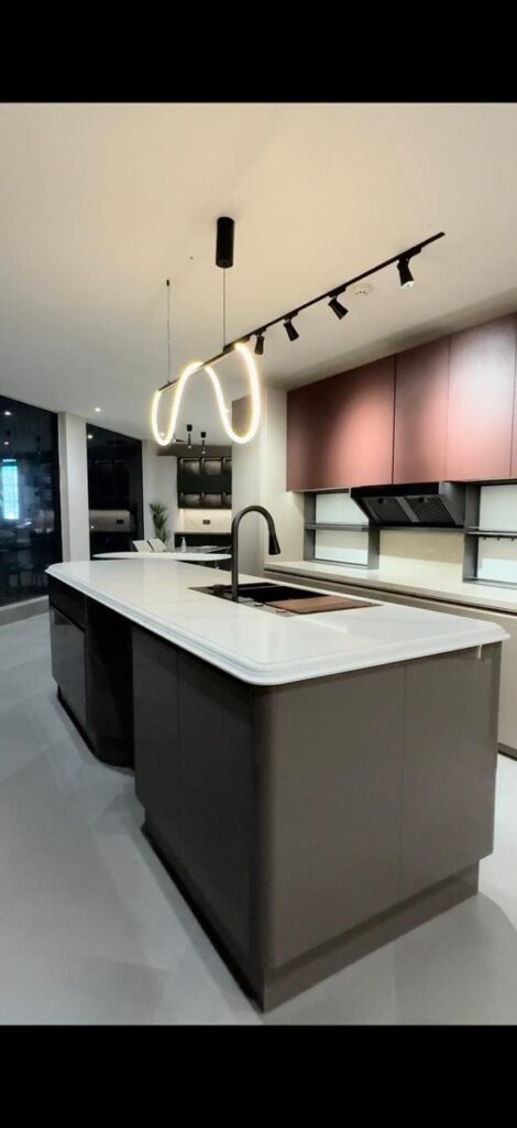 Luxury modern kitchen featuring custom island cabinets and a sintered stone countertop by ORO Kitchens in the UAE